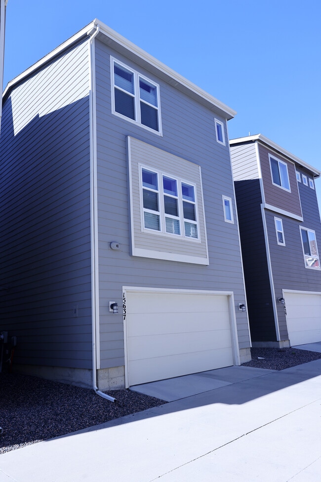 Exterior rear w/2 car garage. - 15637 E Broncos Pl