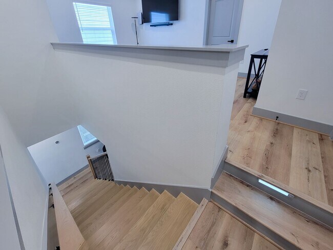 Building Photo - This 4-bedroom, 3-bathroom, two-story residence comes with a generous two-car attached garage. Re...