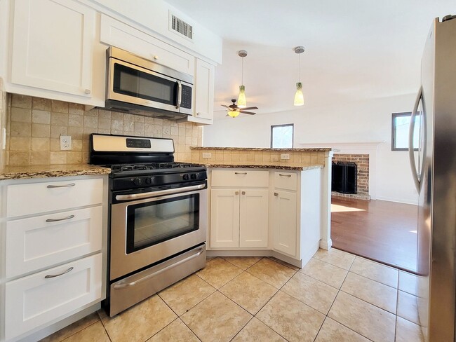 Building Photo - Spacious 4/BR 2.5/BA Two-Story Home with Fireplace & Huge Fenced Yard