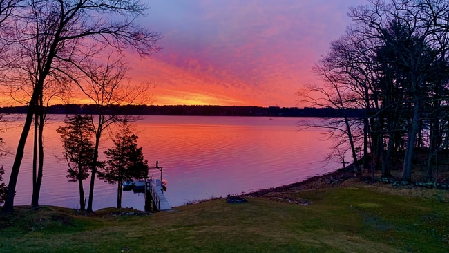 Sunrise from the living room windows - 297 Durham Point Rd