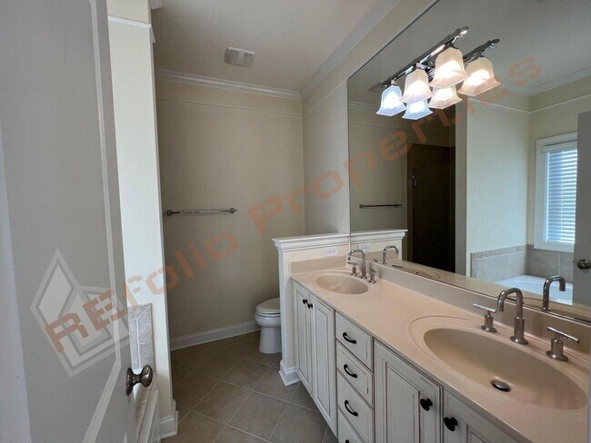 Building Photo - Elegant 3 Story 3 Bedroom Formal Model Tow...