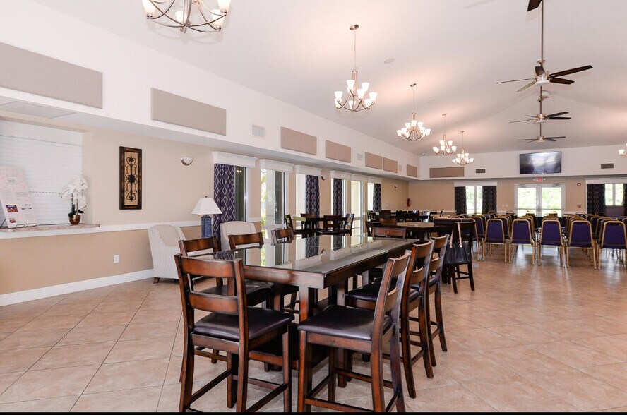 large Dinning table in club house - 798 SW Munjack Cir
