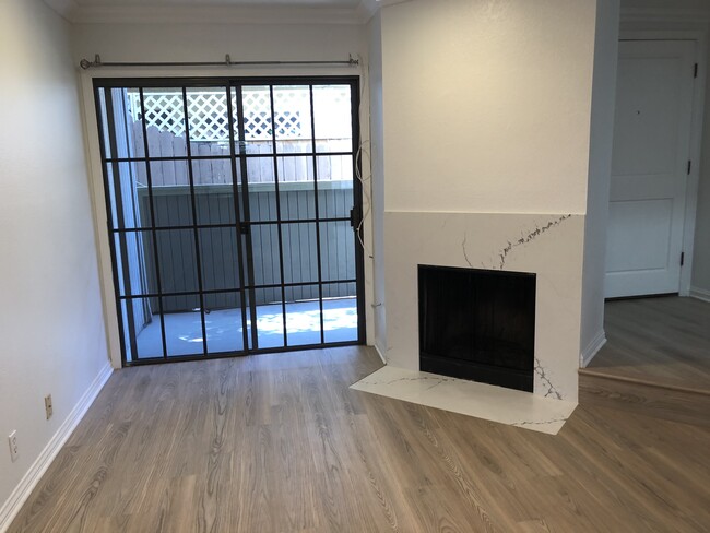 Living room with remodeled fireplace - 3644 Villa Terrace