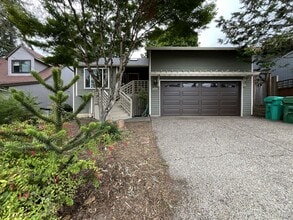 Building Photo - Spacious 3-Bedroom Home with Custom Stone Fireplace, Attached 2-Car Garage & Expansive Backyard i...