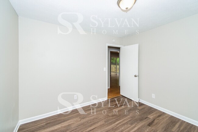 Building Photo - Welcome to this charming abode.