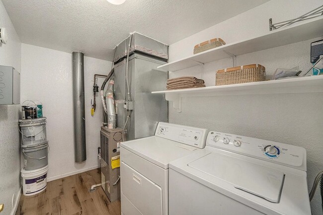 Building Photo - Enjoy modern living in this 3/2 condo. Gre...