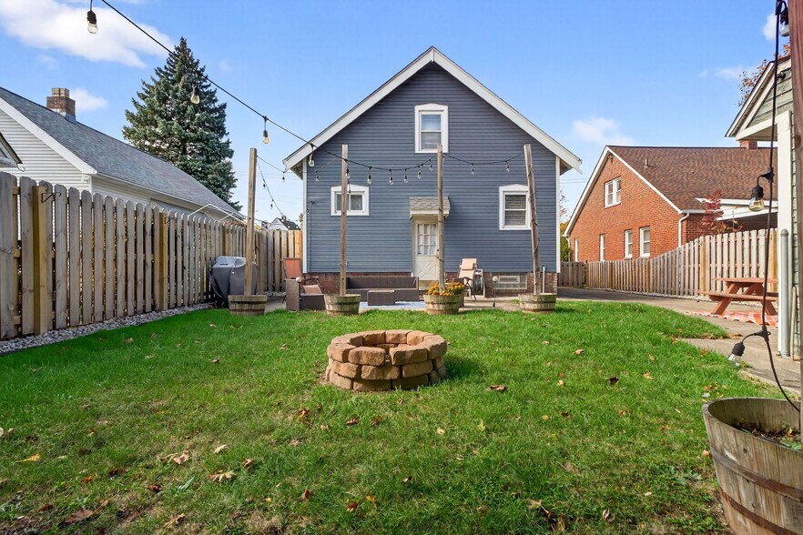 Backyard with Fenced in Yard and String Lights - 4429 S Hills Dr