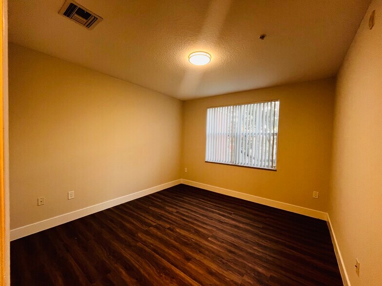 Master Bedroom with Large Window - 4602 SW 160th Ave
