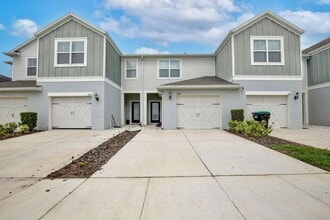 Building Photo - Immaculate Townhome · Dual En-Suite Bedrooms + Flex Loft · Cable & Internet Included · 3.5 Miles ...