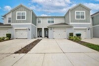 Building Photo - Immaculate Townhome · Dual En-Suite Bedrooms + Flex Loft · Cable & Internet Included · 3.5 Miles ...