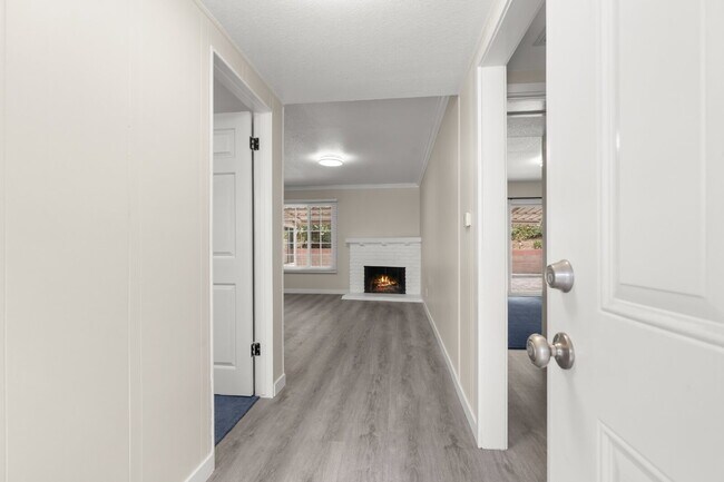 Building Photo - Charming Updated Home With Drive-Through Garage Access