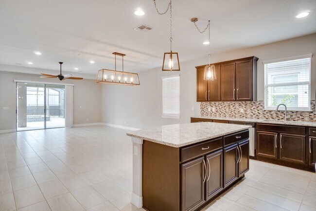 Building Photo - Stunning 3-Bedroom Pool Home with Bonus Room in the Gated Community of Lakeshore at Narcoossee