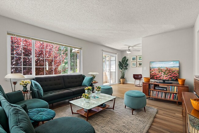 Experience elegance and comfort in this beautifully designed living room. - University Crossing Apartments