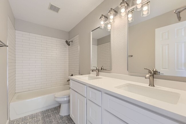 Building Photo - 4 bedroom, 2 1/2 bath home with attached 2...