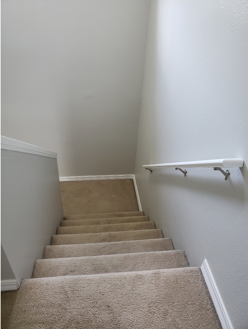 Stairway to upstairs bedrooms and full bathroom - 625 E 22nd Ave