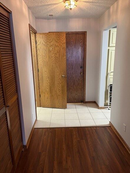 view of entry door and pantry and kitchen entry - 1300 G St