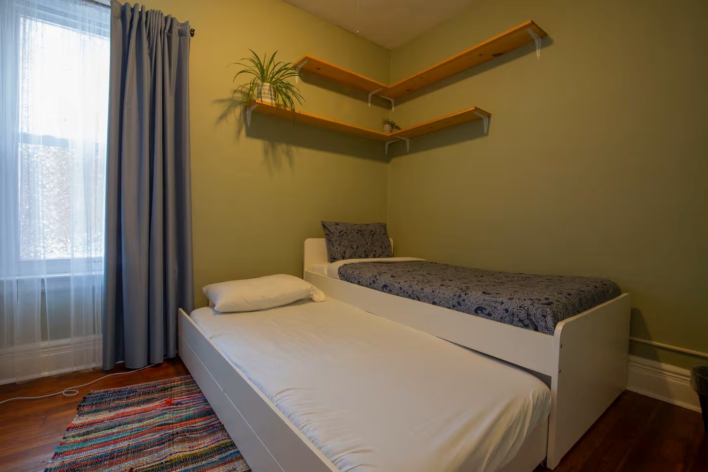 Bedroom #3. Flexible sleeping arrangement. Use as a twin bed. Bedroom #3. Pull out the trundle to ad - 203 W Tupper St