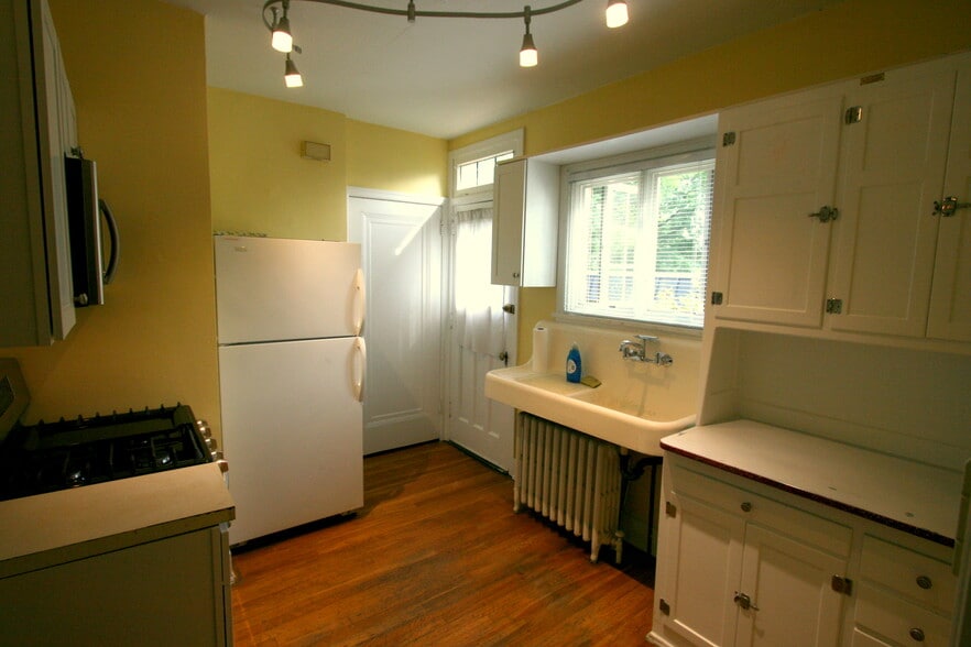 Kitchen looking toward side door and Basement door - 328 S Aiken Ave