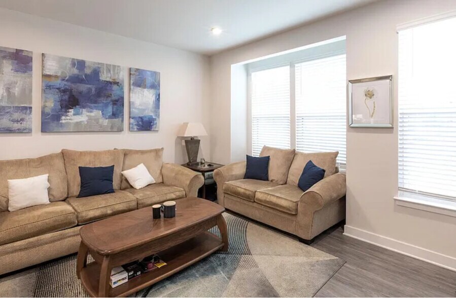 Living area with windows and access to kitchen and convenient 1:2 bath. - 314 Music Hall Way