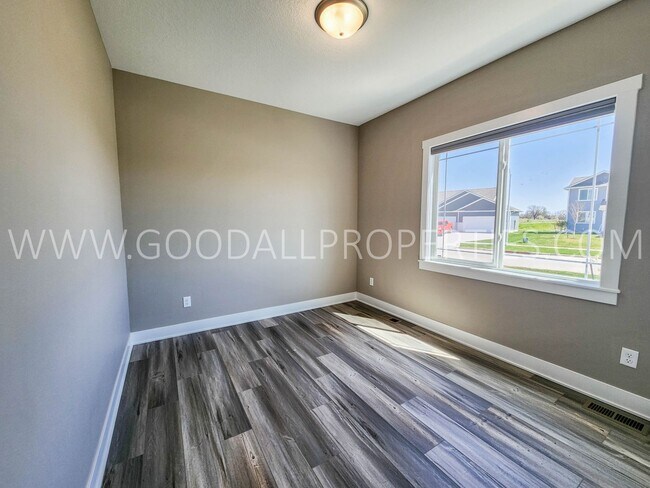 Building Photo - Spacious Waukee Ranch | 4 Bedrooms | 3-Car Garage | Finished Basement