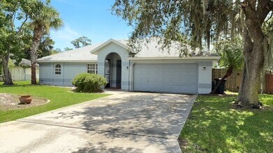 Building Photo - The Woodlands of Palm Coast- FURNISHED- 4 ...
