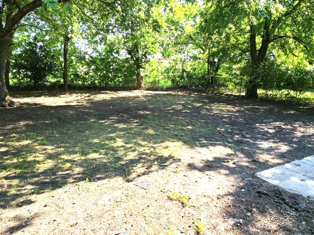 Oversized fenced backyard that now has a wooden fence. - 4244 Asbury Ave