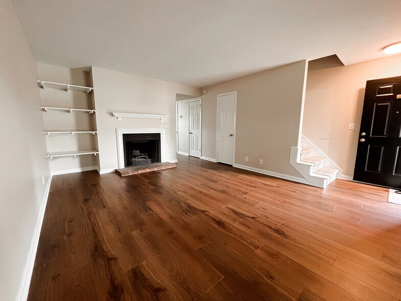 Living Room w/ built-in shelves and fireplace - 5750 Brentwood Trace