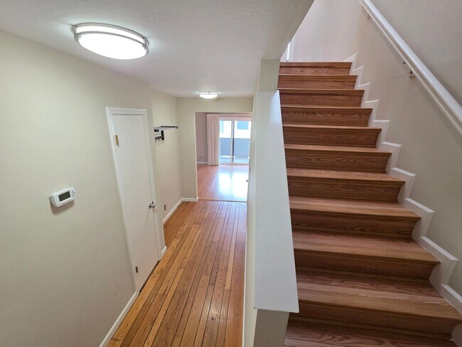 Building Photo - Spacious 2BR Condo with Central A/C, Bonus Room & Huge Storage – Walk to Burlingame Avenue