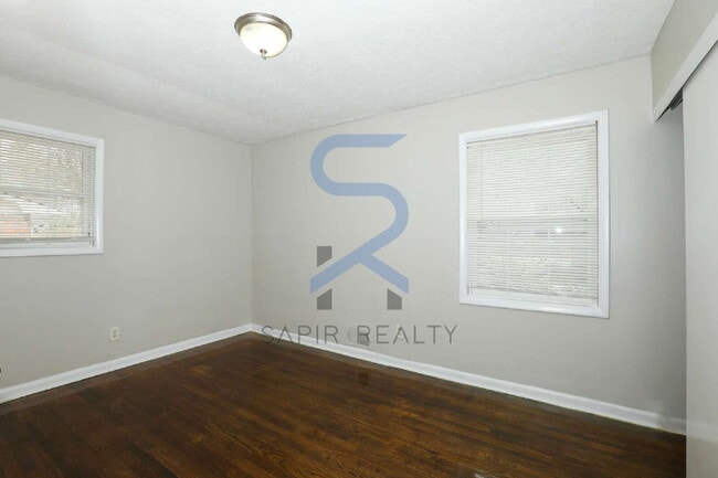 Building Photo - Timeless All-Electric Ranch Charm in a Vibrant, Peaceful Corner of South River Gardens