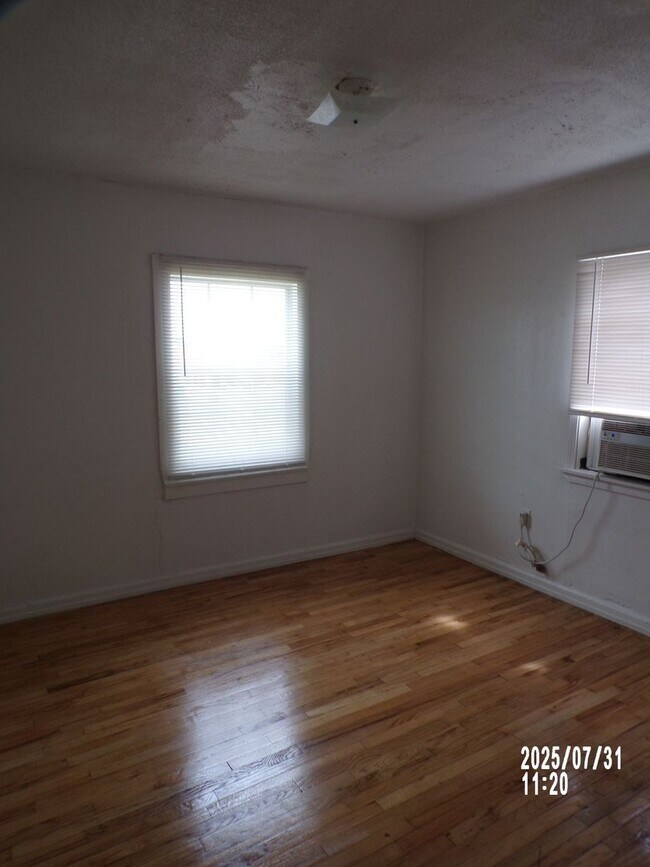 Building Photo - NEW listing-refinished hardwood floors, new laminate and paint throughout