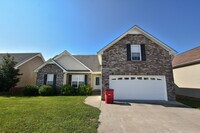 Building Photo - Pet Friendly Three Bedroom with Bonus!