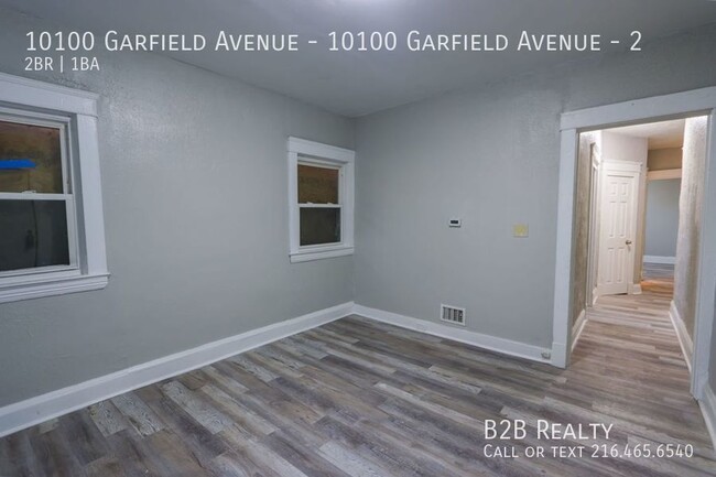 Building Photo - "Charming 2-Bedroom Oasis: Your Perfect Bl...