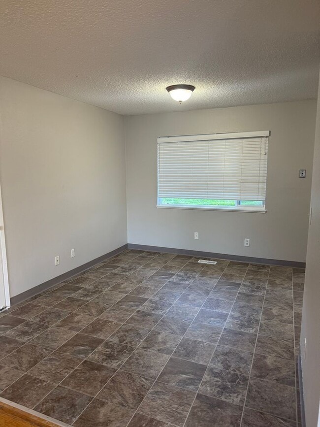 Building Photo - Charming 3 Bedroom with a Living Room, Sun Room,Huge Fenced Yard & More!