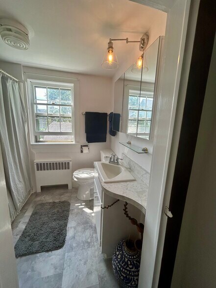 Full bathroom with new vanity , toilet and floors - 32 Meadow St
