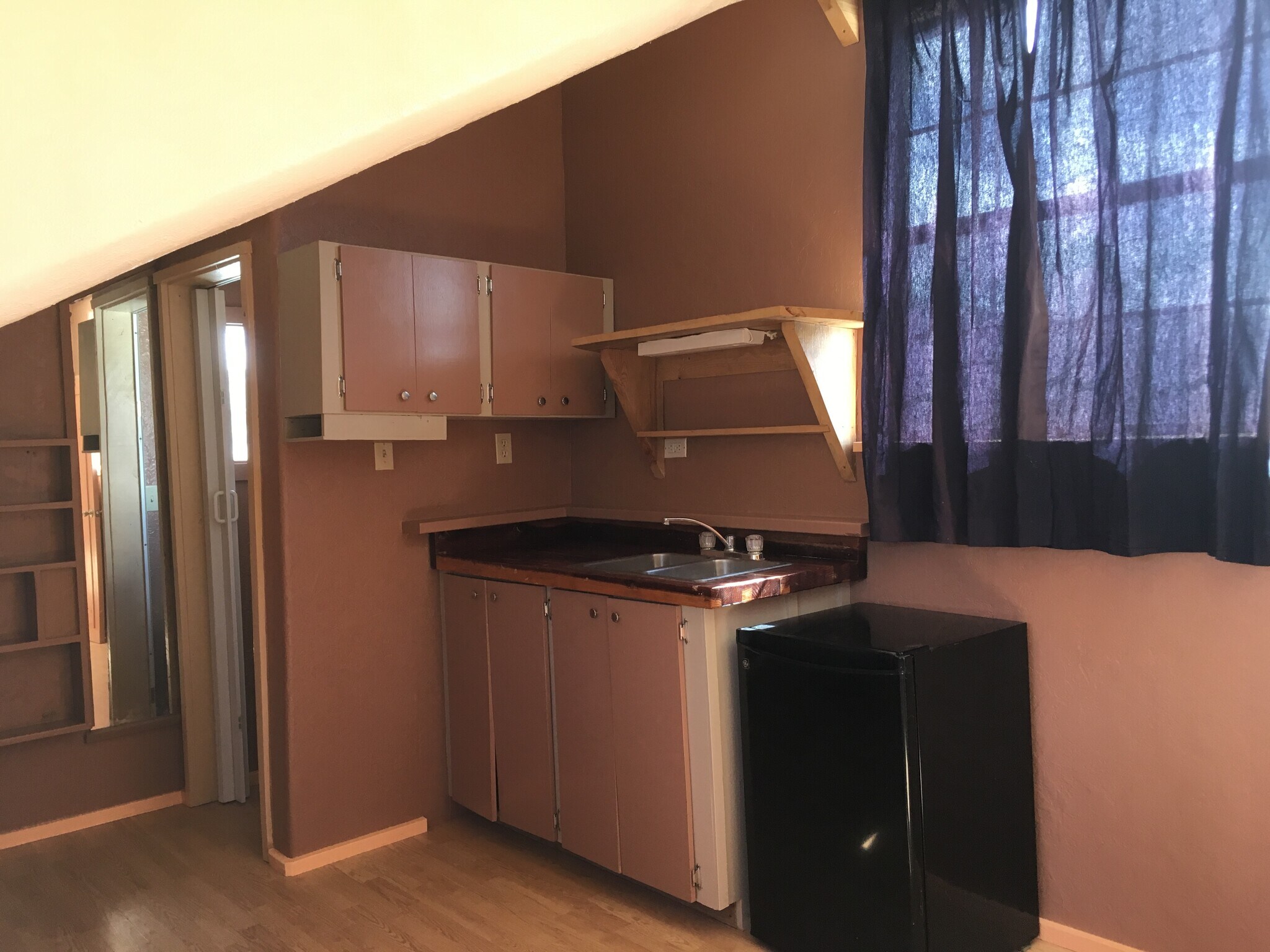 Upstairs bedroom was a efficiency apartment at one time. - 23901 US-70