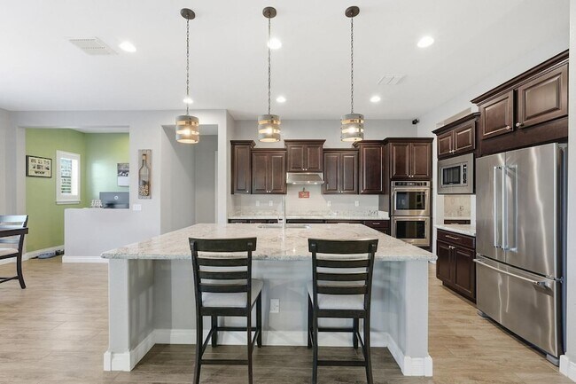 Building Photo - 10702 E Lumiere Ave