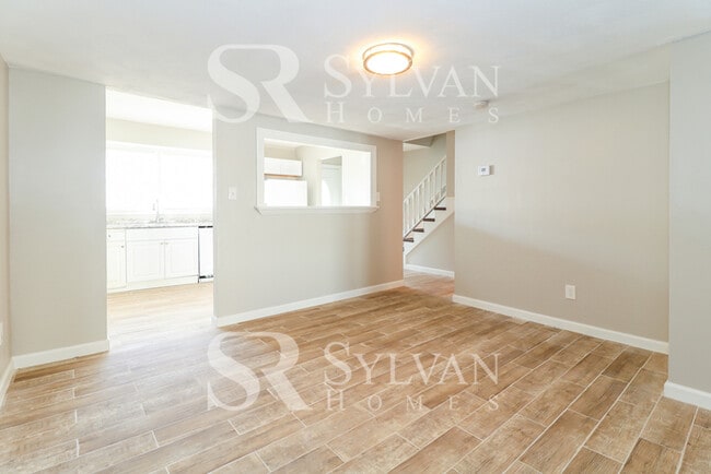 Building Photo - Venture outside to the expansive backyard,...