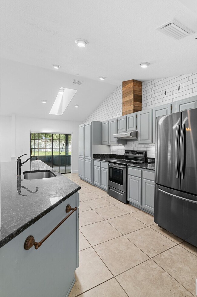 Building Photo - **Available February 2026***Welcome Home :: 3/2 with oversized fenced backyard in Indian Pines!