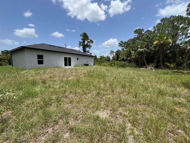 Building Photo - NEW CONSTRUCTION- Modern 3 Bed / 2 Bath Home in Lehigh Acres