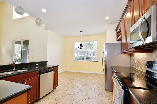 Building Photo - Elegant 3/3 Spacious Townhome with a 2 Car...