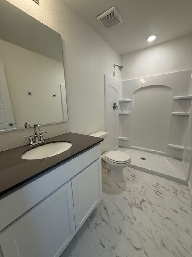 Building Photo - New 2 Bedroom Townhome + 2 Car Garage
