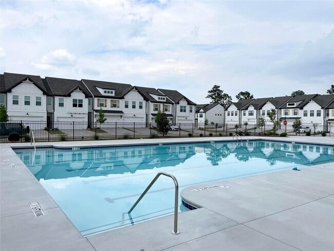 Building Photo - Stylish 3BR Townhome with Private Yard & T...