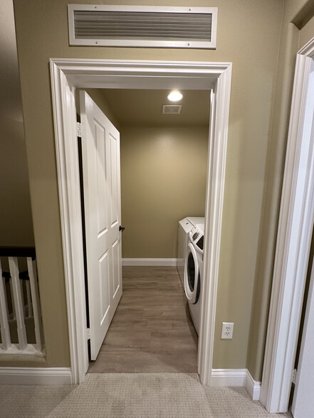 Laundry room on 2nd floor near primary bedroom - 12975 Agustin Pl