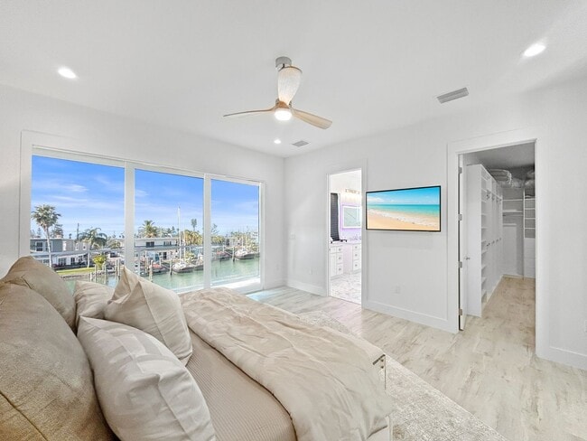 Building Photo - Waterfront Johns Pass Luxury | Steps to Beach + Pool, Hot Tub & Dock