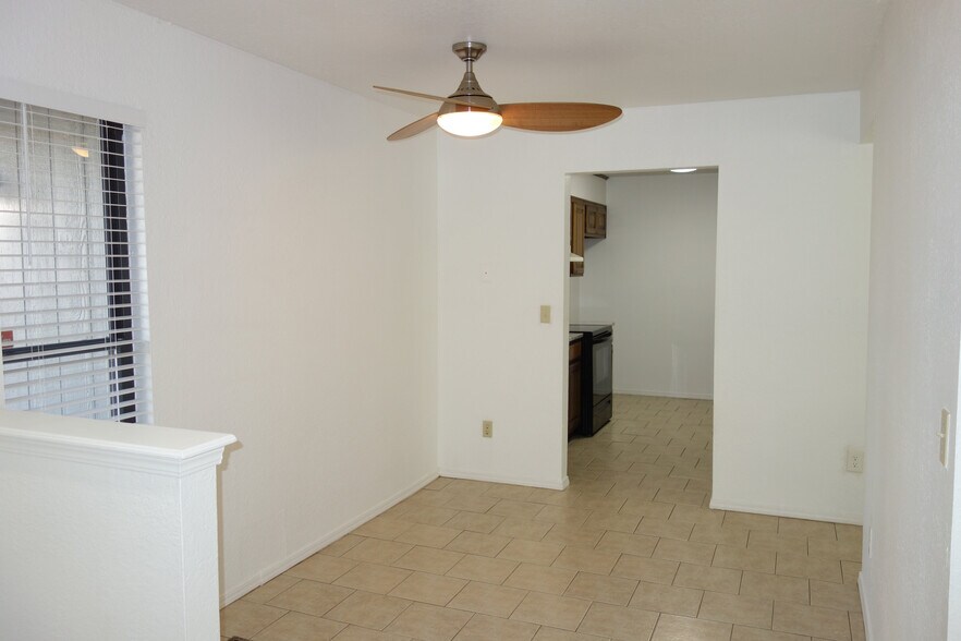 Dining Area with kitchen beyond - 6604 S Utica Pl