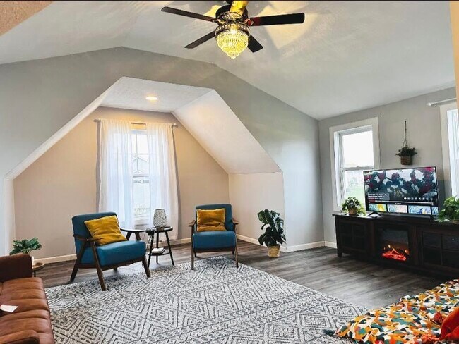 A gorgeous bonus room, newly built and versatile enough to serve as a fourth bedroom, featuring five - 4555 Cider Wood Dr NW