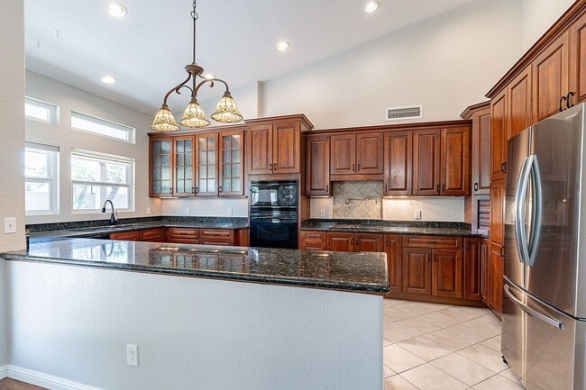 Building Photo - Charming 4-Bedroom Home with Luxurious Poo...
