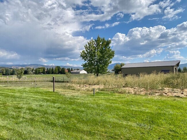 Building Photo - Beautiful home single level entry with out buildings and amazing landscaping - shorter term lease...