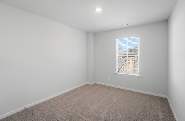 Building Photo - 4BR Home in The Pines at Paw Creek – New Construction + Private Deck