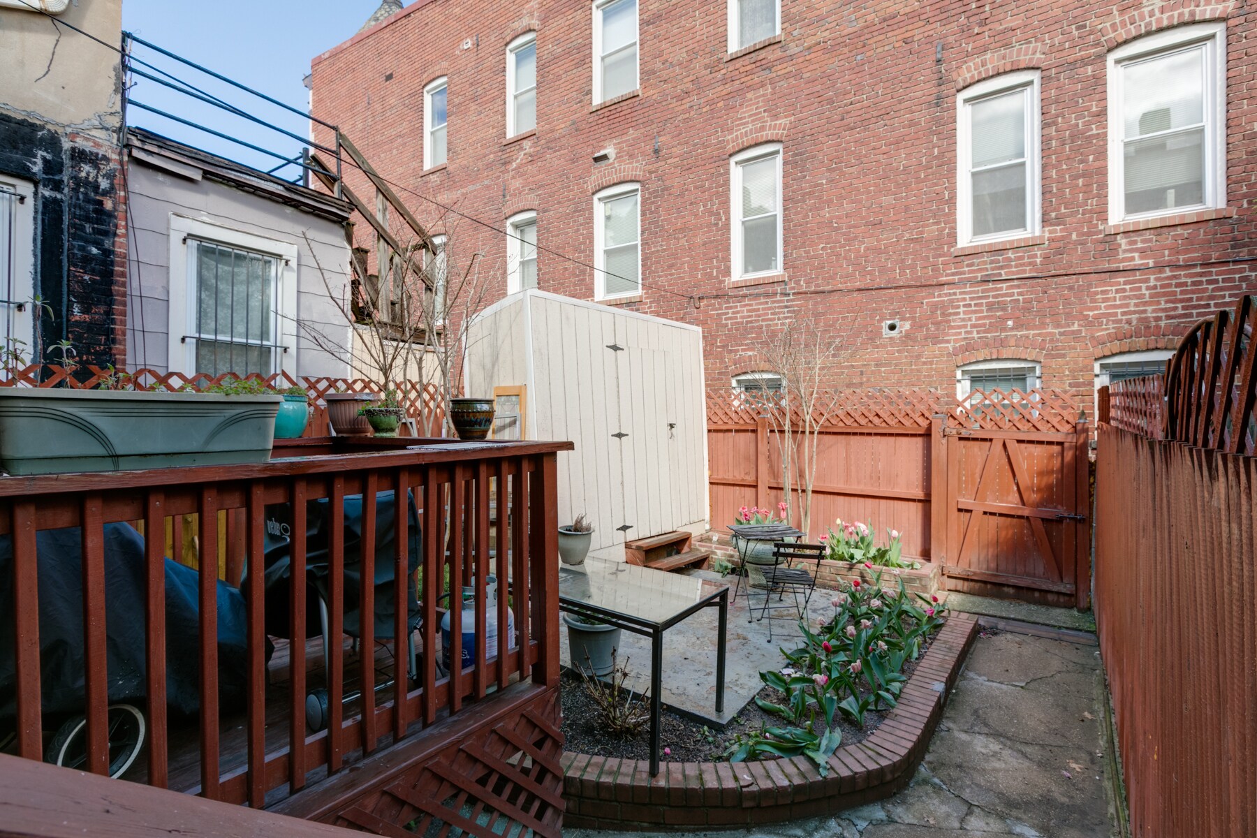 Backyard is communal space with upstairs tenants - 1819 North Capitol St NE
